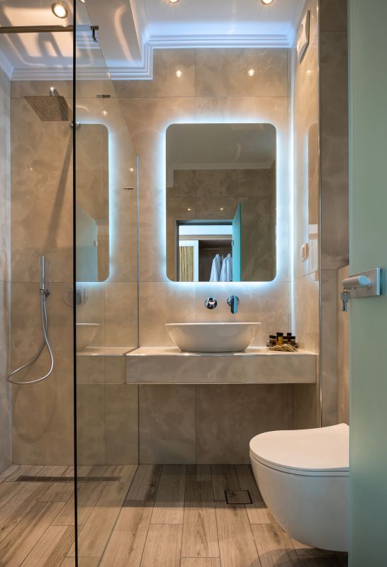 Elegant Bathroom with Backlit Mirrors